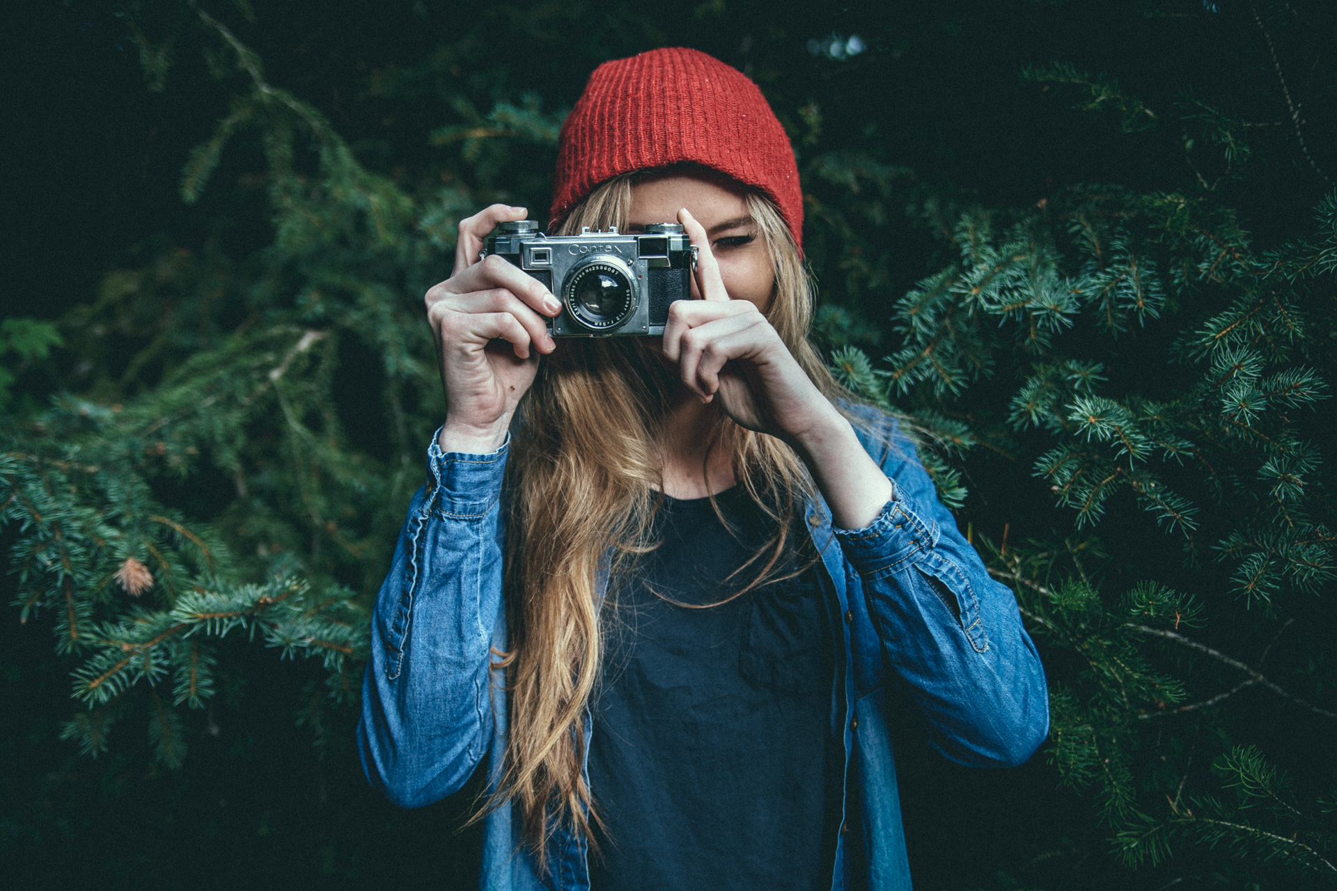 Woman taking picture with a camera